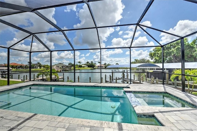 view of pool with a lanai, a water view, a patio area, a boat dock, and an in ground hot tub