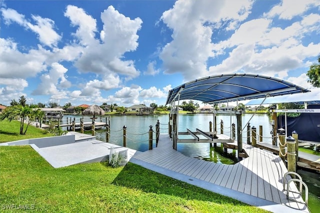 dock area featuring a water view and a lawn