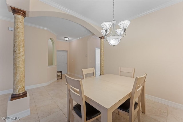 dining area featuring ornate columns, a chandelier, crown molding, and light tile patterned floors