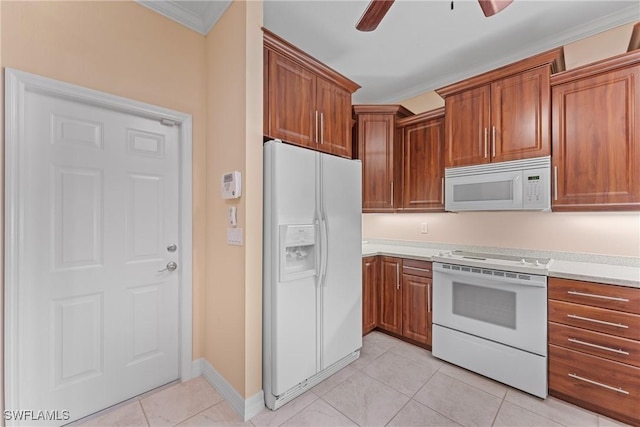 kitchen with crown molding, white appliances, light tile patterned floors, and ceiling fan