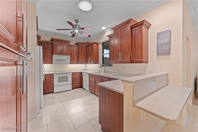 kitchen with kitchen peninsula, crown molding, sink, white appliances, and a breakfast bar area