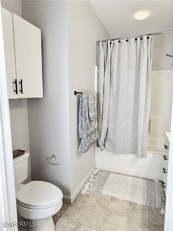 bathroom with shower / bathtub combination with curtain and toilet