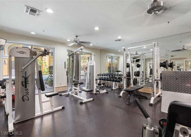 workout area with a healthy amount of sunlight and ceiling fan