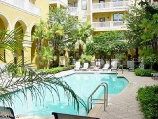 view of swimming pool with a patio area