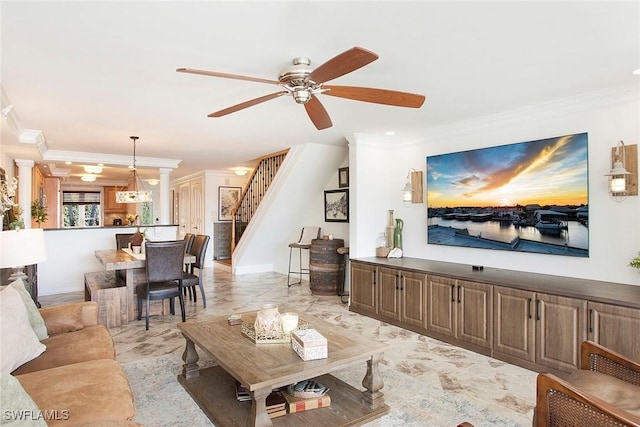 living room with ornamental molding, ceiling fan, and ornate columns