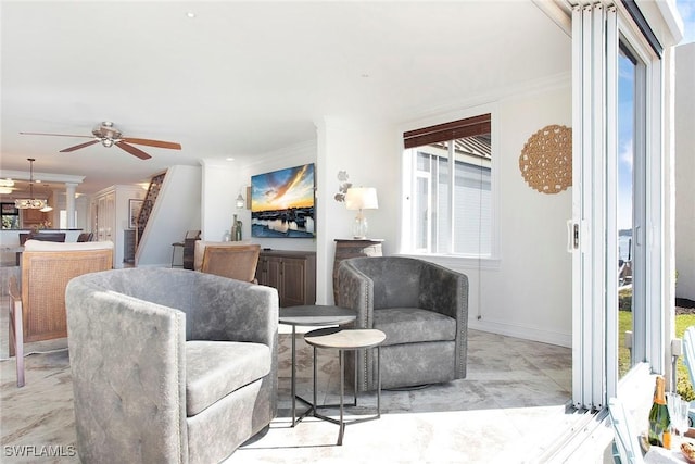 interior space featuring crown molding and ceiling fan