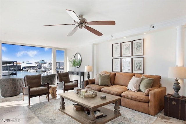 living room featuring ceiling fan, ornamental molding, and floor to ceiling windows