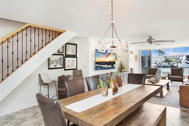 dining area featuring crown molding and ceiling fan