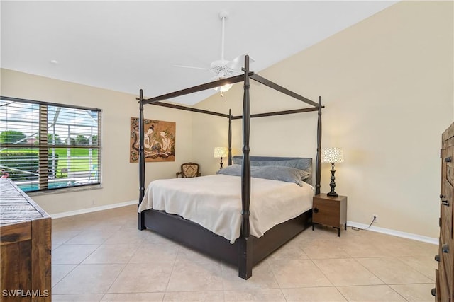 bedroom with lofted ceiling, light tile patterned floors, and ceiling fan