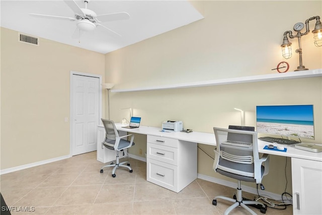 tiled home office with built in desk and ceiling fan