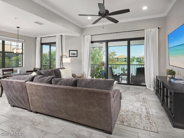 living room featuring ceiling fan with notable chandelier and crown molding