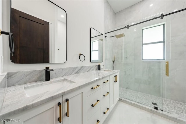 bathroom featuring vanity and a shower with shower door