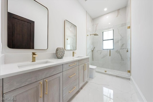 bathroom featuring toilet, a shower with door, and vanity