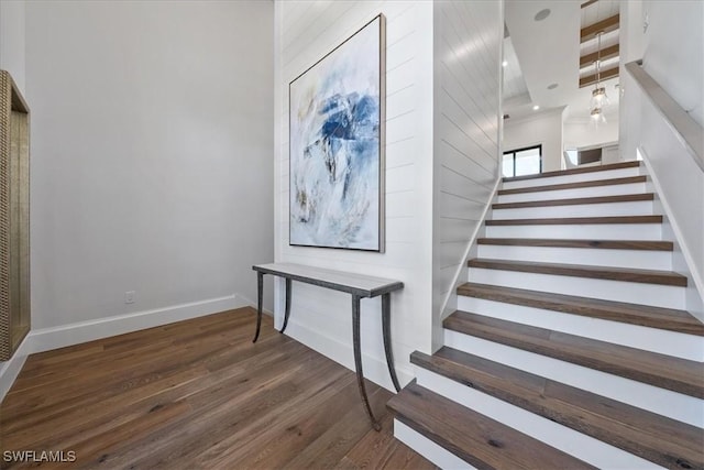 stairway with wood-type flooring