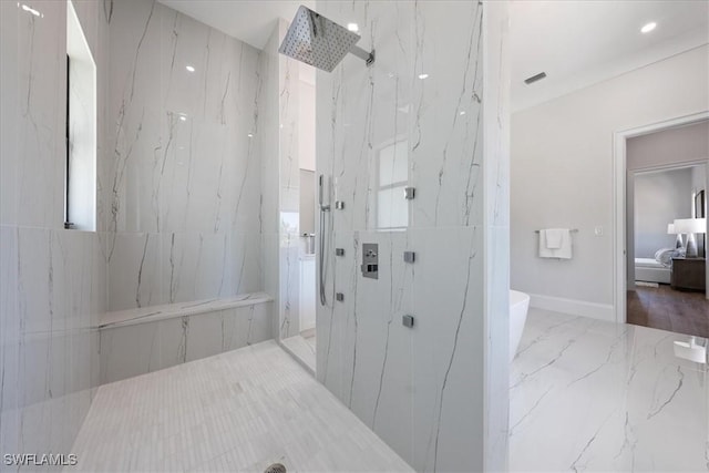 bathroom featuring a tile shower