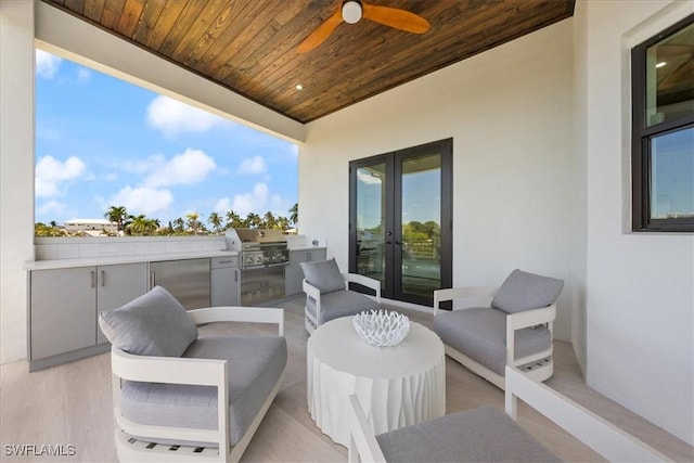 view of patio featuring ceiling fan, french doors, grilling area, and area for grilling