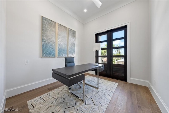 office area featuring ornamental molding, light hardwood / wood-style flooring, and french doors