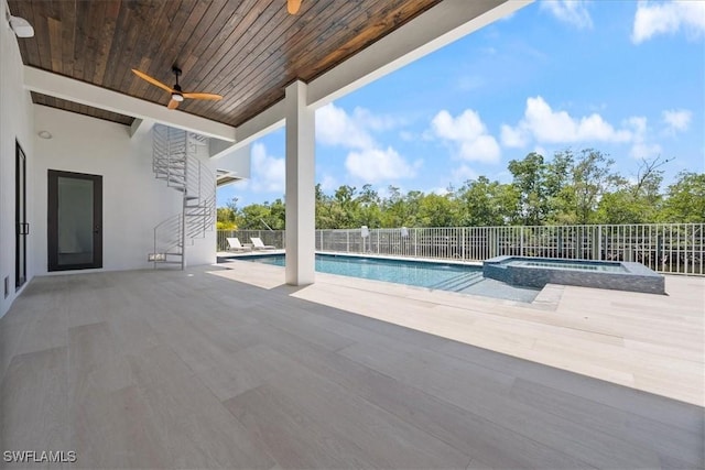 view of pool featuring an in ground hot tub, a patio area, and ceiling fan