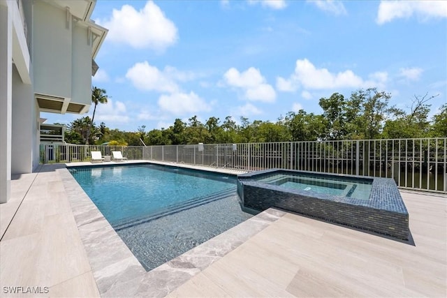 view of pool with an in ground hot tub and a patio area