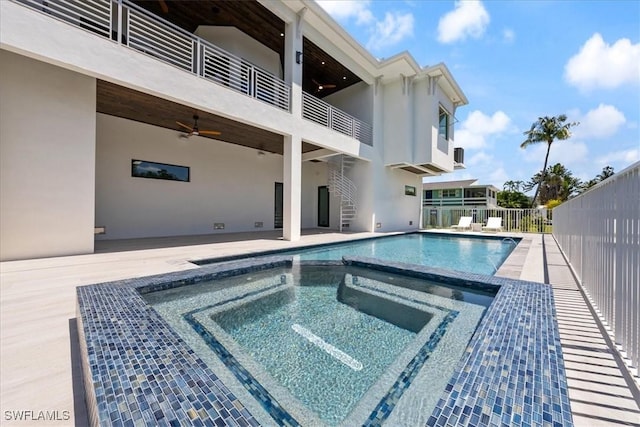 view of swimming pool featuring an in ground hot tub and ceiling fan