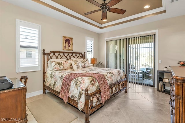 tiled bedroom with ceiling fan, access to exterior, multiple windows, and a raised ceiling