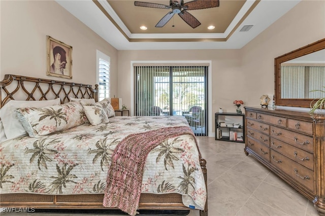 bedroom with ceiling fan, a raised ceiling, and access to outside