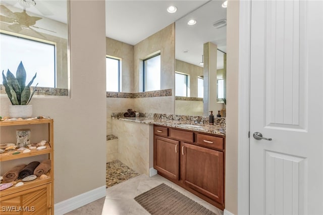 bathroom with tile patterned floors and vanity