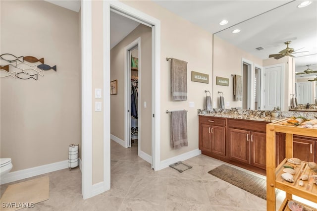 bathroom with vanity, ceiling fan, tile patterned floors, and toilet