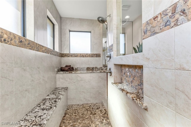 bathroom with a tile shower