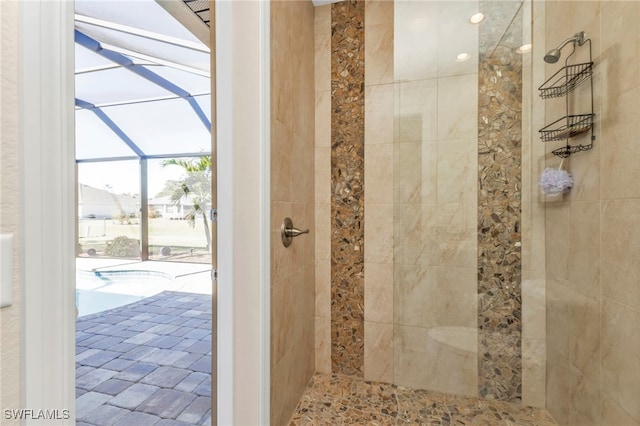 bathroom with tiled shower