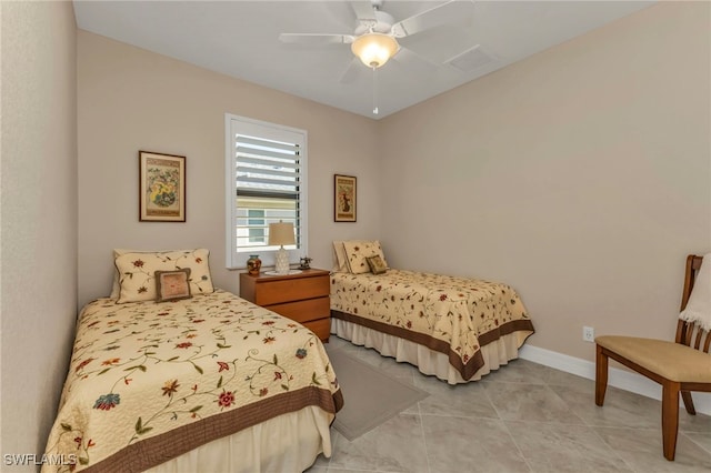 bedroom featuring light tile patterned flooring and ceiling fan