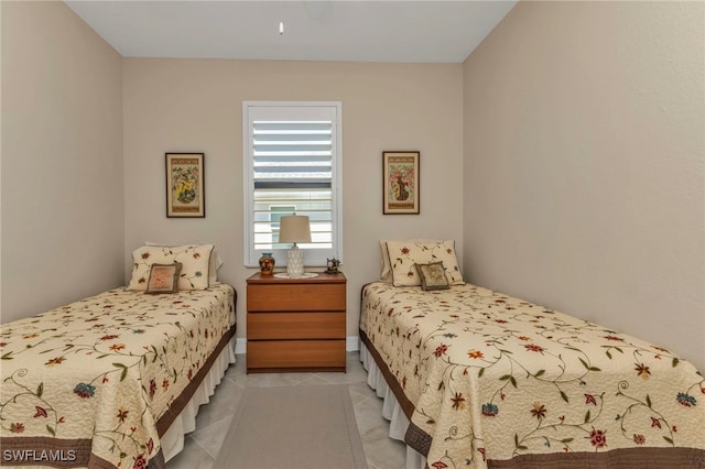 bedroom with light tile patterned flooring