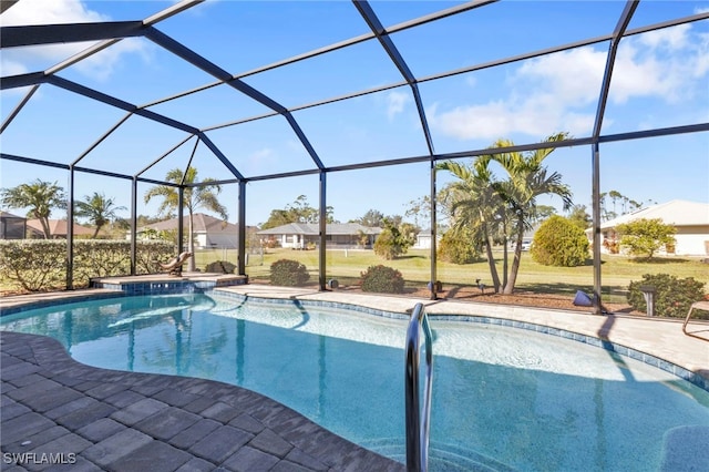 view of swimming pool featuring glass enclosure and a patio