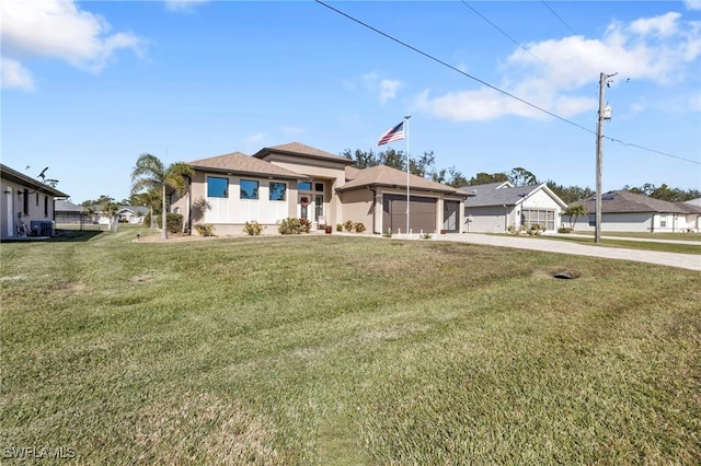 view of front of property with central air condition unit, a garage, and a front lawn