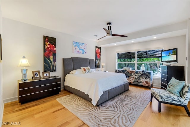 bedroom featuring hardwood / wood-style floors and ceiling fan