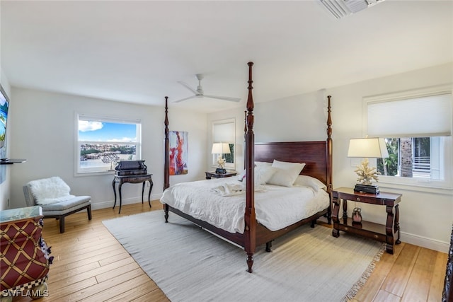 bedroom featuring light wood-type flooring and ceiling fan