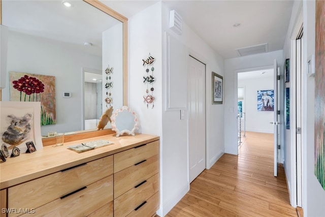 hall with light hardwood / wood-style floors