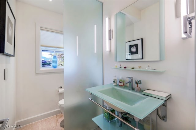 bathroom with sink and toilet