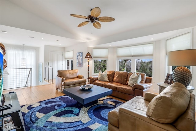 living room featuring hardwood / wood-style flooring and lofted ceiling