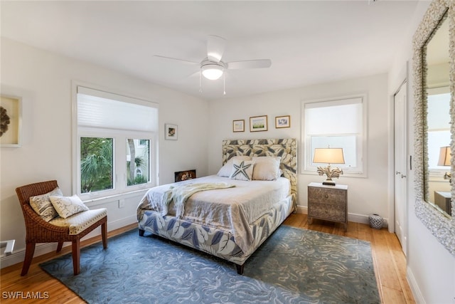 bedroom featuring ceiling fan and hardwood / wood-style floors