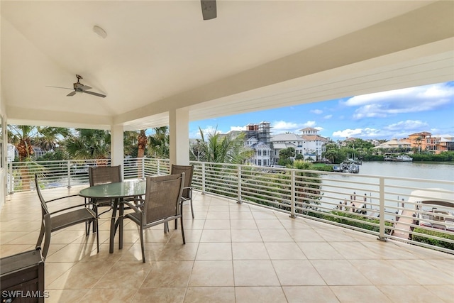 view of patio / terrace with a balcony, a water view, and ceiling fan