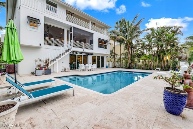 view of swimming pool with a patio