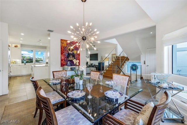 dining room featuring light tile patterned floors and a chandelier