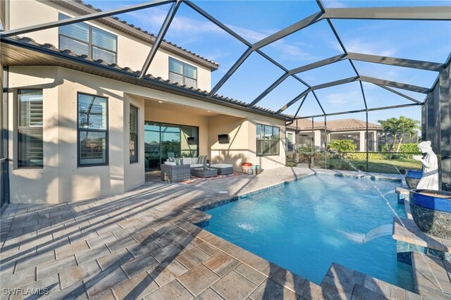 8750 Cavano St E, Naples, FL 34119 - swimming pool featuring outdoor lounge area, a patio area, and glass enclosure