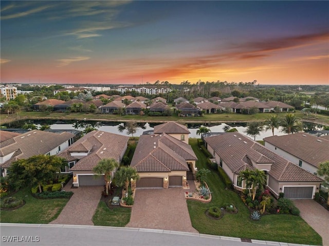 8750 Cavano St E, Naples, FL 34119 - aerial view at dusk of a water view and a residential view