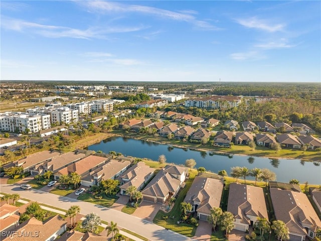 aerial view featuring a residential view and a water view