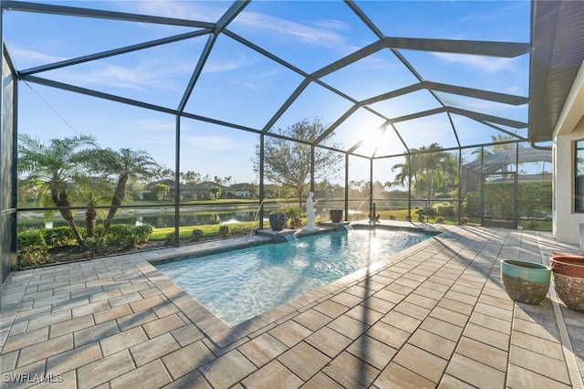 outdoor pool featuring a patio, a water view, and a lanai