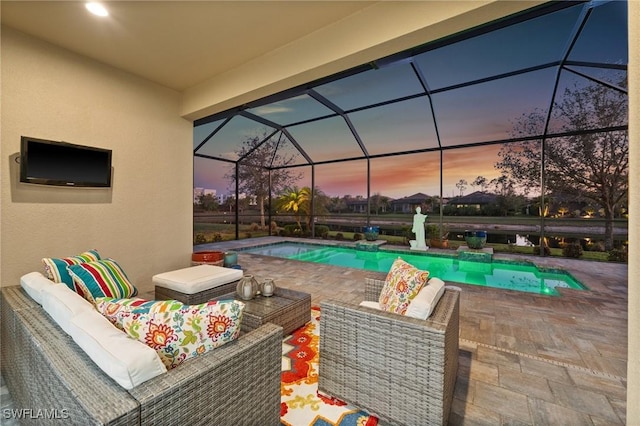8750 Cavano St E, Naples, FL 34119 - pool at dusk with an outdoor pool, an outdoor hangout area, a patio, and a lanai