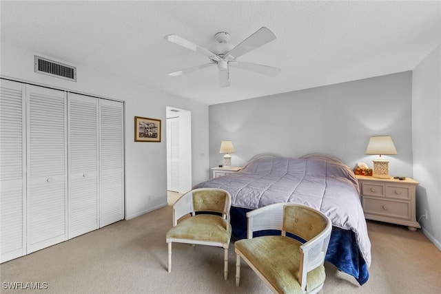 bedroom featuring ceiling fan and light carpet