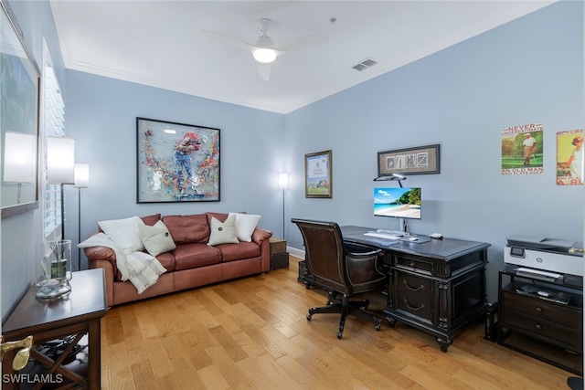 office area featuring crown molding, ceiling fan, and light hardwood / wood-style floors